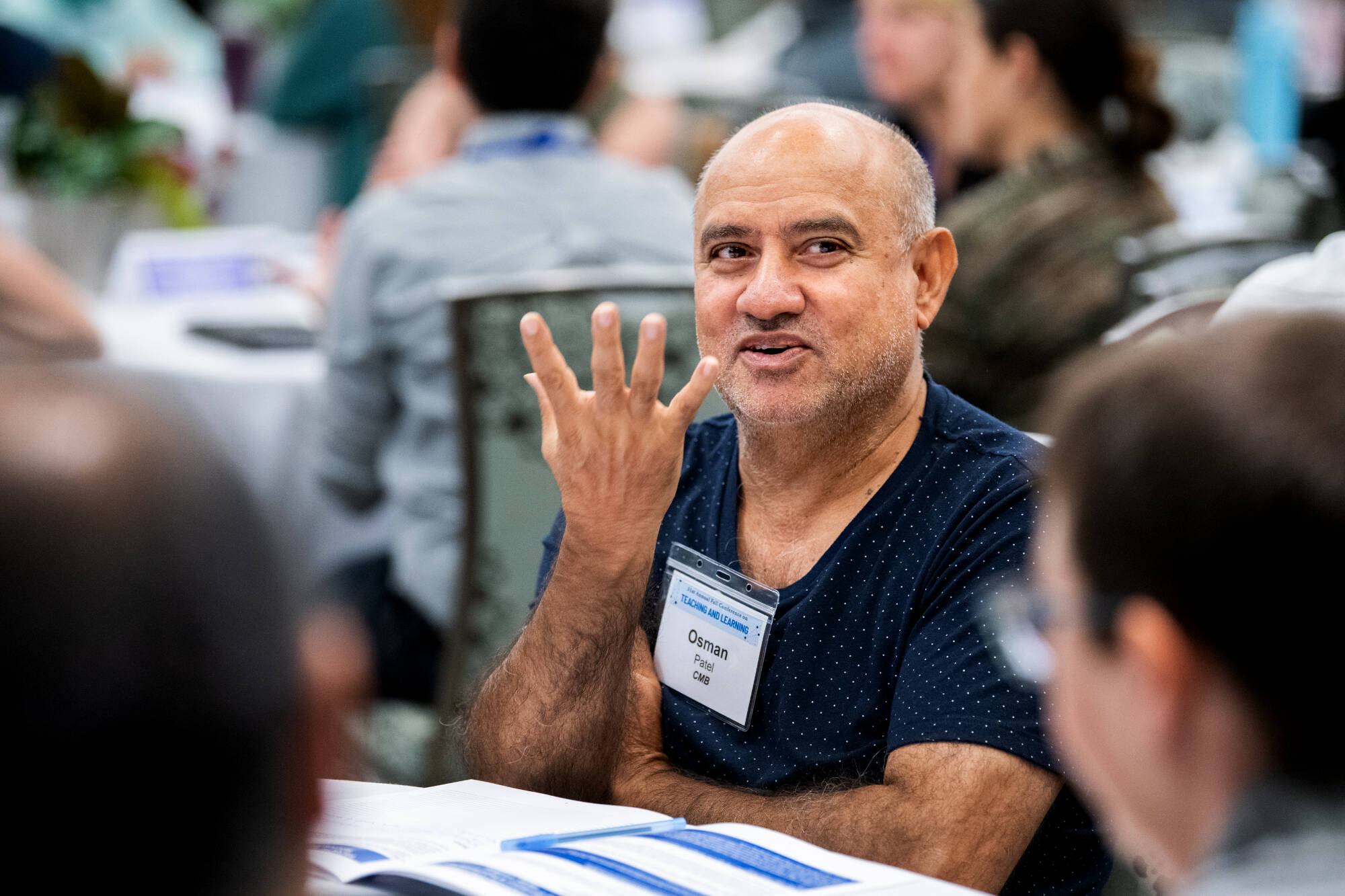 Osman Patel, professor of cell and molecular biology, participates in group discussion during the 31st Annual Fall Conference on Teaching and Learning at Eberhard Center August 14.